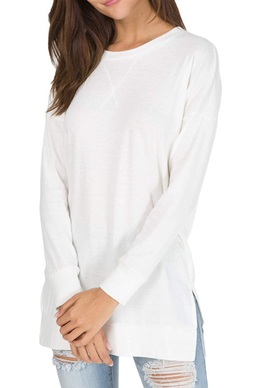 Women's long sleeve white loose top with side slits.