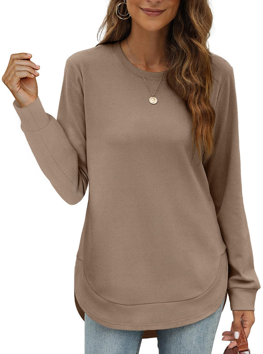 Women's high low curved hem top with crew neck, long sleeves, and solid color design.