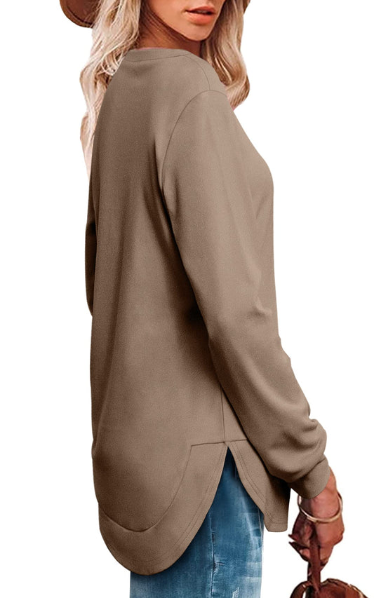 Women's high low curved hem top in solid color with loose fit and side split design.