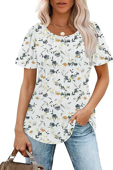 Casual scooped neck top with floral pattern and short sleeves.